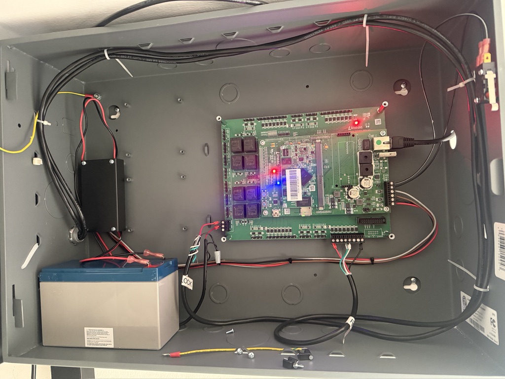 Linear access-control board and backup battery mounted inside a metal enclosure